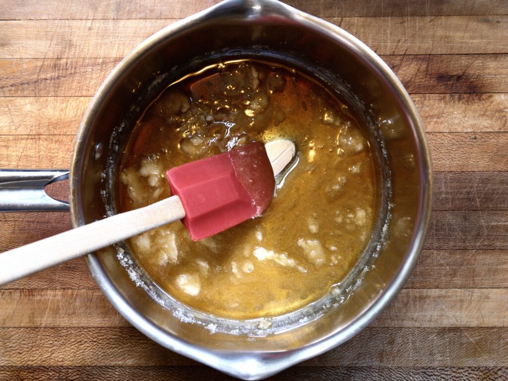 First stage of amber melted sugar. Creme brûlée coffee syrup.